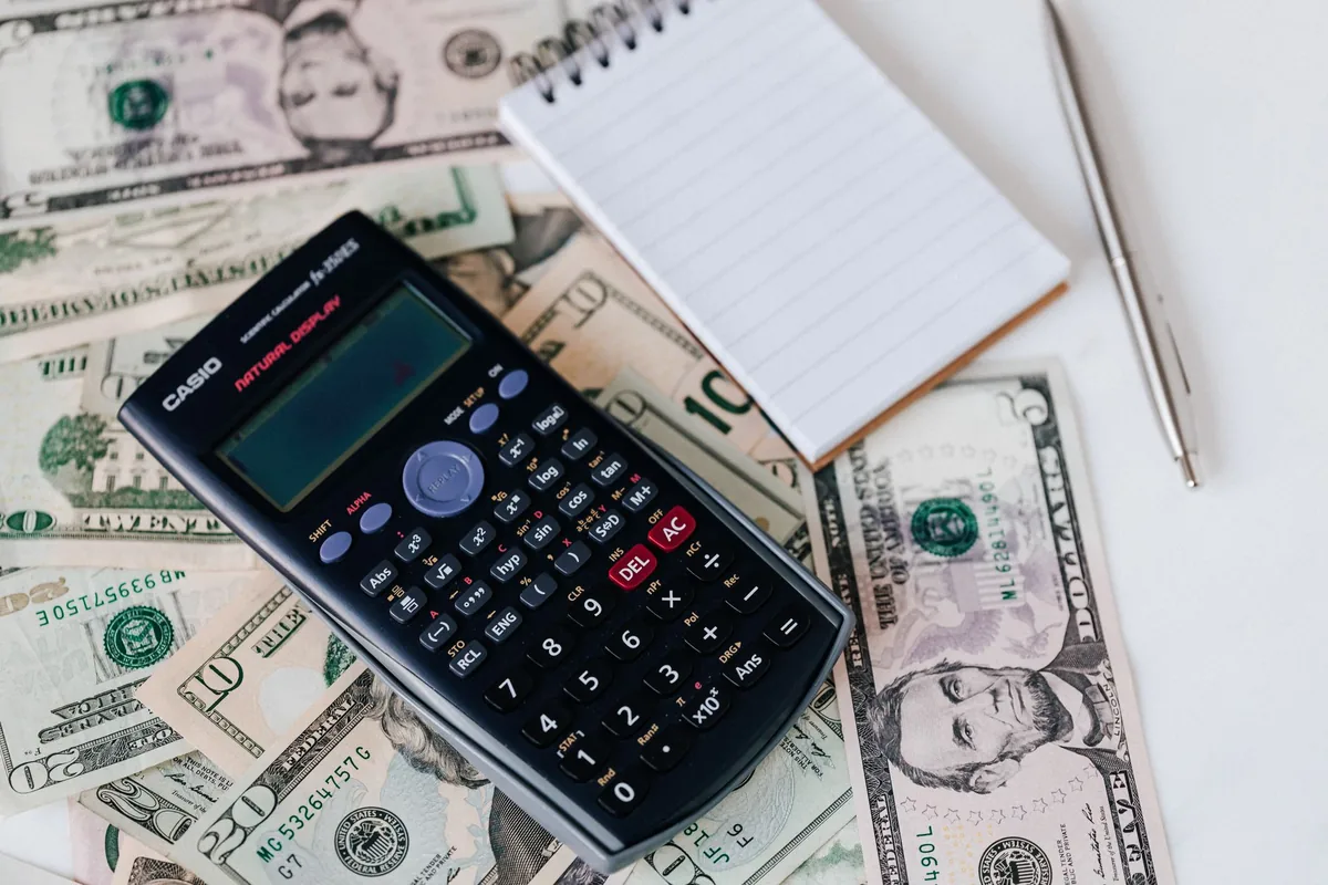 A coach reviewing cash flow management for a coaching business