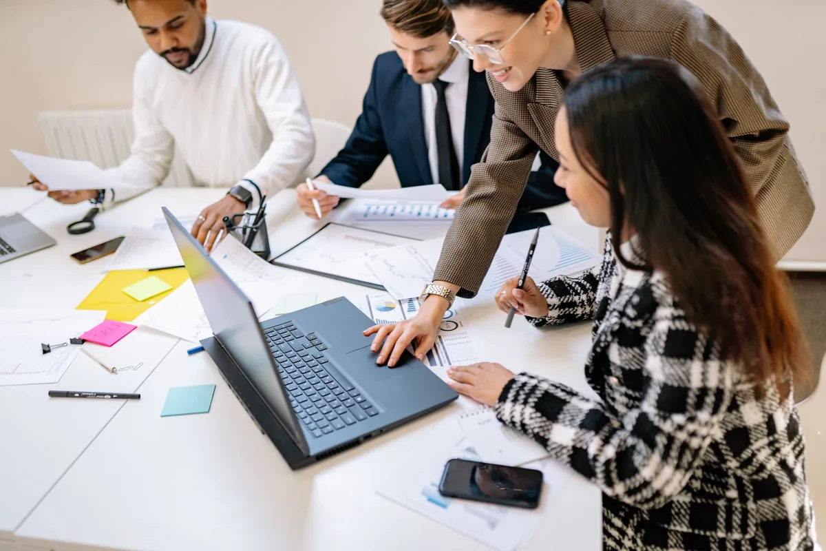 Team collaborating as they grow a coaching business into a scalable company