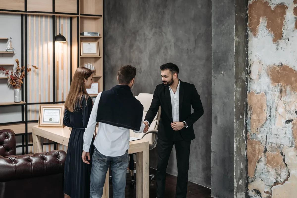 A business coach meeting a new client, showing how to get coaching clients