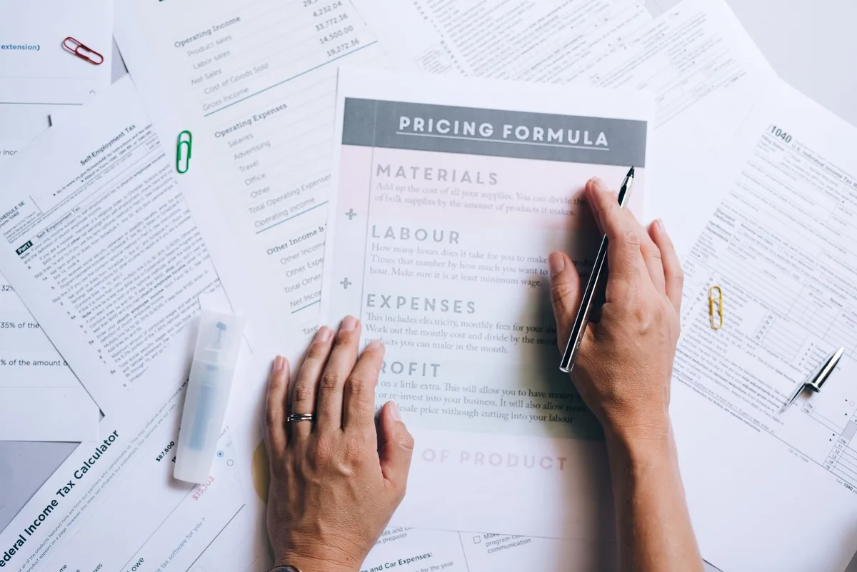 Coach calculating how to price coaching packages for profit